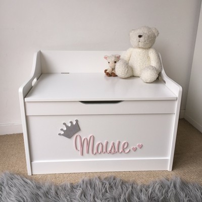 toy boxes with names on