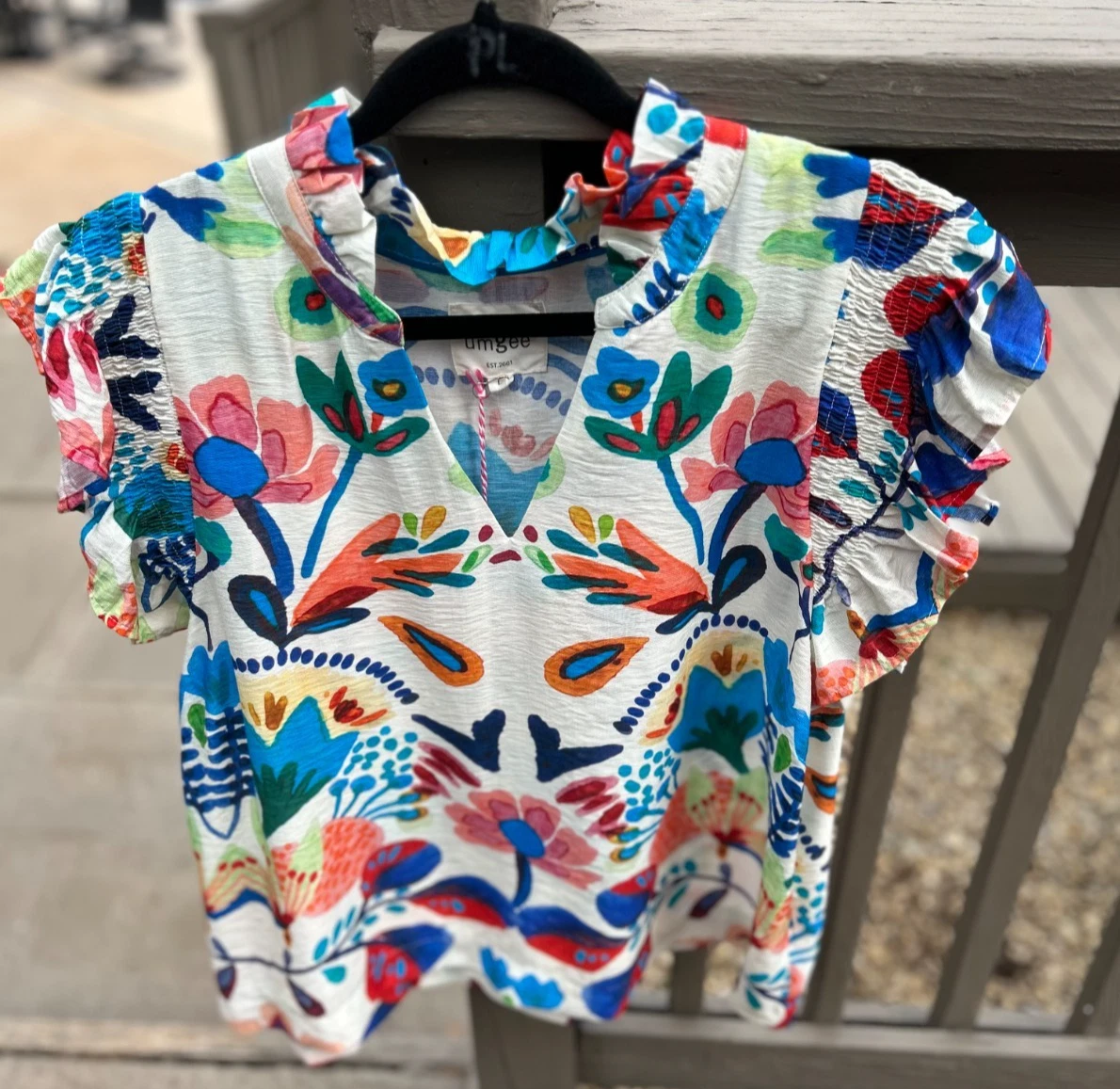 Umgee Multi Floral Top with V Neck & Smocked Flutter Sleeves
Opens in a new window or tab