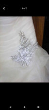 It's a Vera wing size 6 wedding dress ivory color and the front is a skirt