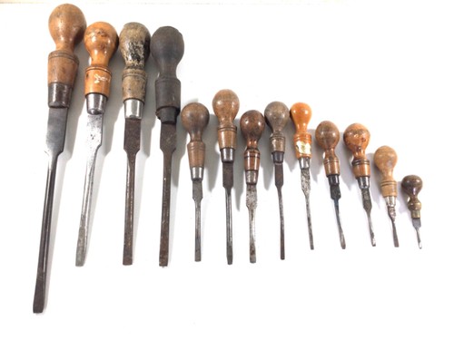 Thirteen vintage wooden handled screwdrivers
