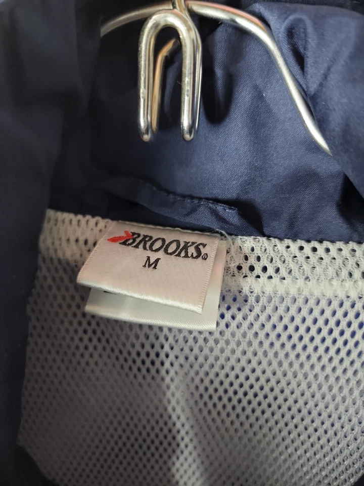 Chaqueta cortavientos Brooks para hombre M azul reflectante con forro de malla ventilada para exteriores Foto 3 de 4