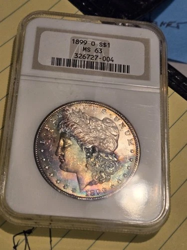 1899 O MS63 NGC Morgan with vivid rainbow obverse