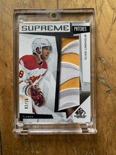 2023-24 Upper Deck SP Game Used - Supreme Patches Elias Lindholm #2 /15 