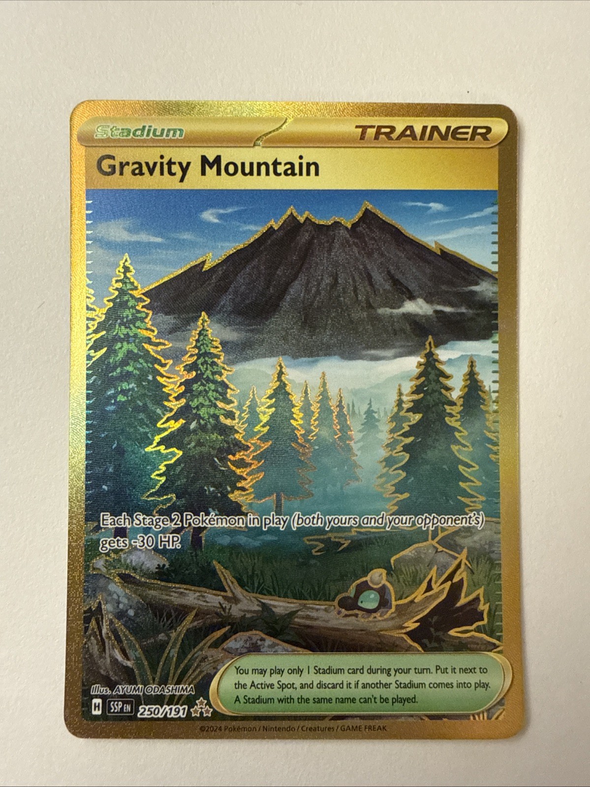Gravity Mountain 250/191 Gold Hyper Rare 2024 Pokemon Surging Sparks Card NM+