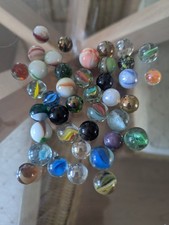 Collection of 40 old vintage colourful marbles all sizes.