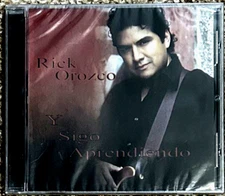 CD-RICK OROZCO-Y SIGO APRENDIENDO-2010-TEJANO-SEALED-MINT-SEALED