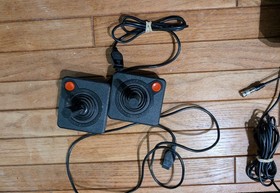 Atari CX2600A Console, two sticks, two paddles, and two games. Tested & Working!