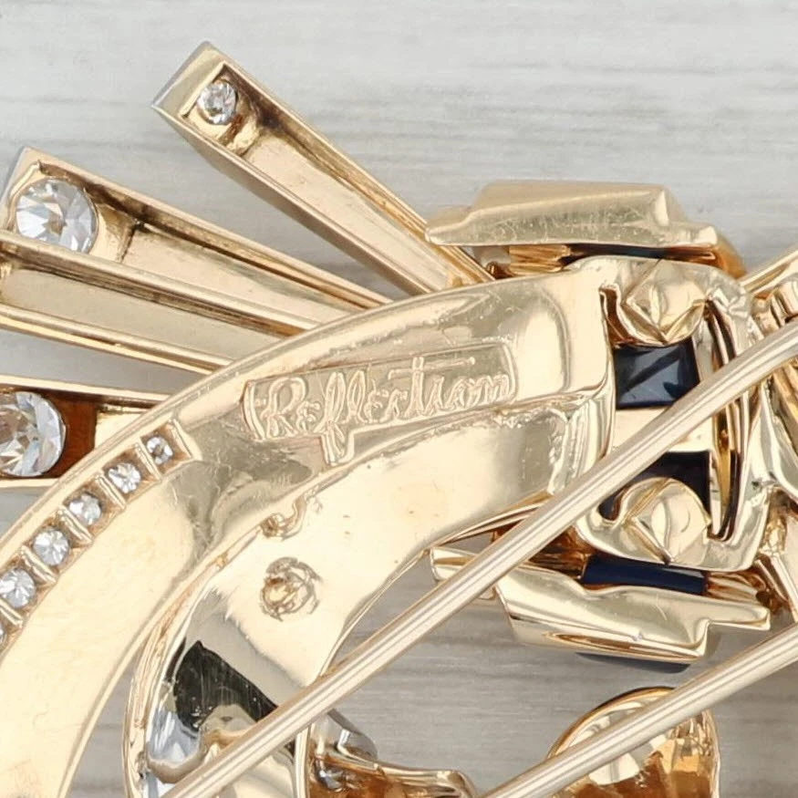 Broche clip piel reflectante Trabert Hoeffer Mouboussin zafiro diamante oro 14k Foto 4 de 4