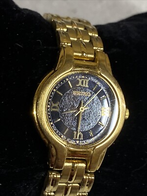 Seiko Ladies V701-2D70, Gold Toned Black Dial Quartz watch  display picture 1
