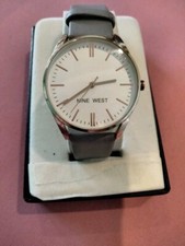 Nine West ladies watch gray straps, gold tone bezel & case with white dial