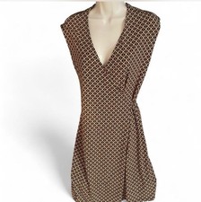 Michael Kors wrap dress. a pattern with gold links and brown straps.