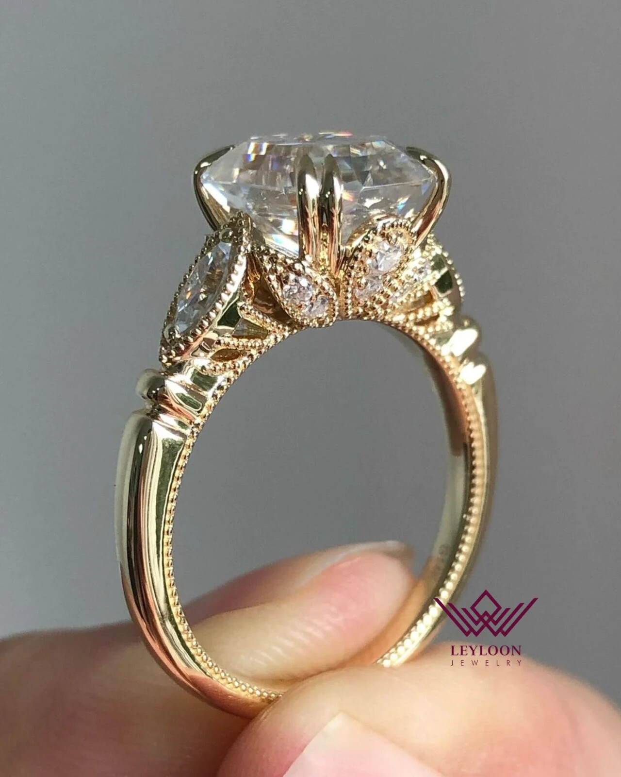 Emerald Cut D Color Three Stone Moissanite Ring in 10K Gold