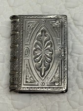 ANTIQUE BOOK SHAPED MATCH VESTA STRIKER BOX SILVER TONE BRASS ORNATE DESIGN