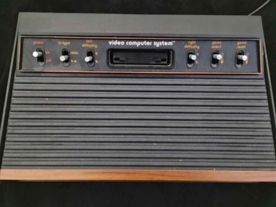 Atari CX 2600 A Wood Grain Video Computer System with Controllers Paddles Games