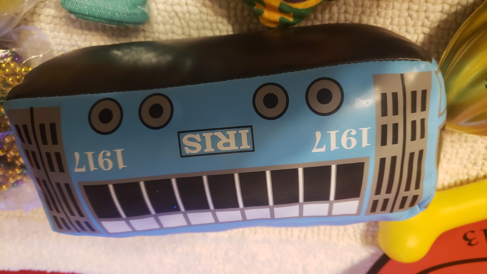 MARDI GRAS PARADE THROWS! LOT OF 18!! IRIS STREETCAR, FOOTBALLS, BEADS