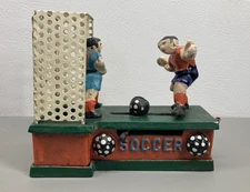 Vintage Soccer Themed Cast Iron Mechanical Coin Bank 7.5” Long 6.5” Tall