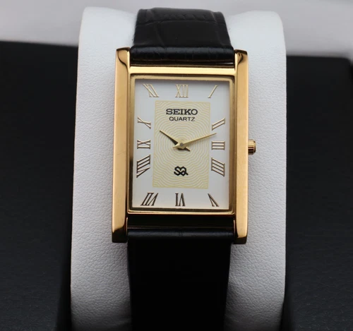 Vintage Seiko Slim Quartz Men's Wrist Watch White Dial with Black Strap.