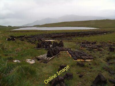 Photo 6x4 Peat stacks, Loch Tarbhaidh Loch Tarbhaidh/NC2955 Peat is deri c2012