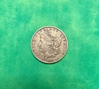 US 1878 REV OF 78 7 TAIL FEATHERS MORGAN DOLLAR COIN IN ABOUT UNCIRCULATED