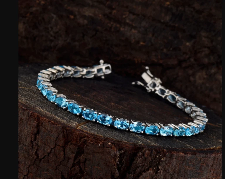 Brazalete de tenis Swiss Blue Topacio ovalado 6*4 platino sobre plata de ley 925 7 pulgadas Foto 2 de 3