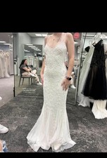 David’s bridal size 0, white floral beaded wedding dress, never worn.