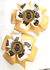 Beautiful UCF Knights Set of Pigtail hair bows for girls.