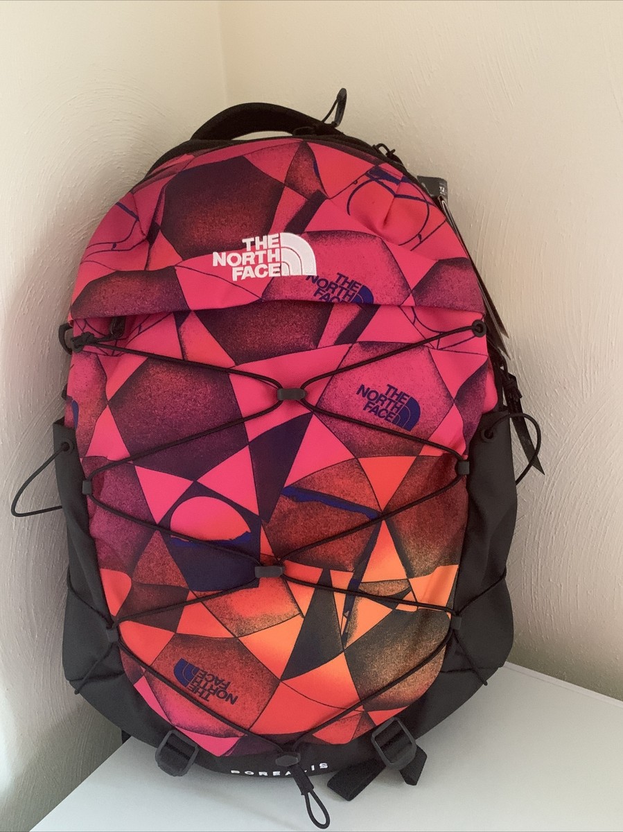 multicolored pattern north face backpack Supreme / The Steep Tech Multicolor Dragon Ballistic Nylon plus PU and Acrylic Co Polymer Wax Leather pull tabs Felt lined shoulder strap Two separate zippered compartments one is on the top and the other is on the bottom Day pack is on the smaller side Metal Hardwear 19X 14 X 6 25 Liters Chapter One COLOR BLOCK 68 OG Day Pack The 25 Borealis Backpack - 28L
