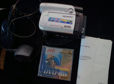 Samsung VP-DC161 Camcorder. Silver . DVD-RW disc. Charger/AV lead. Not charging