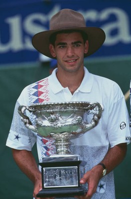 American tennis player Pete Sampras wearing a bushman hat as he ho- Old Photo