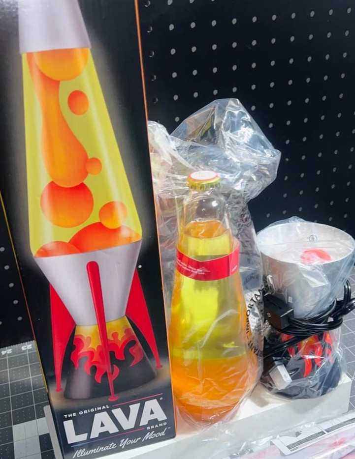 A Spencer's-exclusive rocket-shaped lava lamp with a flame base is peak retro-futurist desk candy — actual functional art.