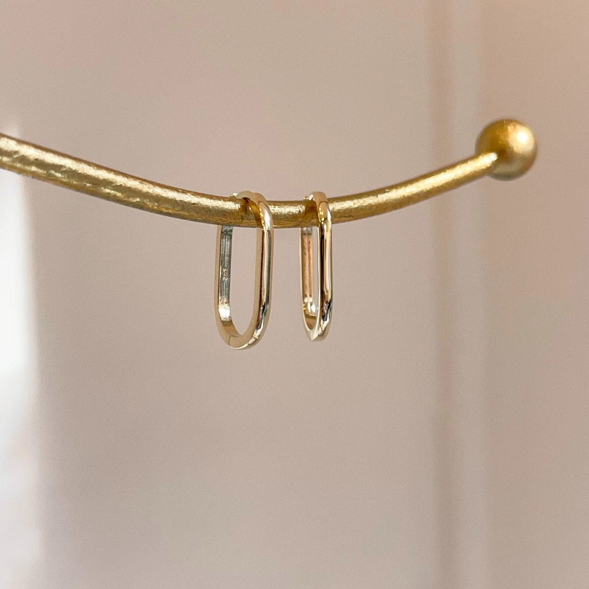 Thin gold oval shop hoop earrings
