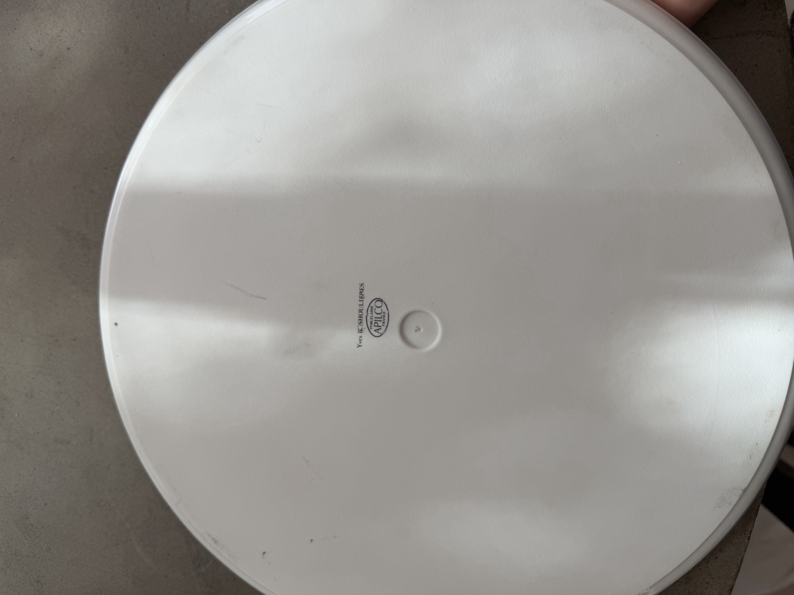 Philippe Deshoulieres Apilco porcelain plate with a fruit design. 11 7/8"