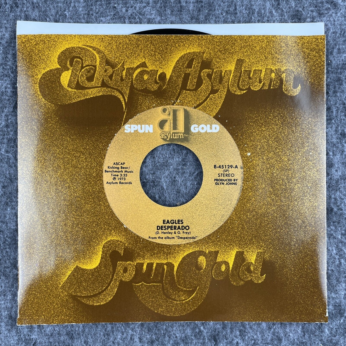 EAGLES Desperado / Outlaw Man 45 Asylum Spun Gold E-45129 NEW