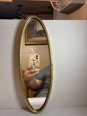 Hobby Lobby oval wall mirror with a gold-tone metal frame