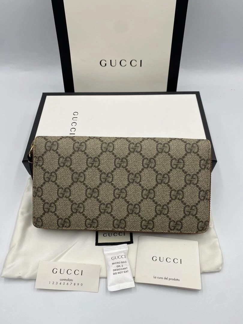 Portefeuille long Gucci GG Supreme rond zippé beige occasion authentique