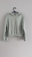 Women's cropped hoodie with elastic hem and hood, mint color, size M.