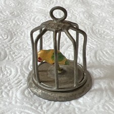 Vintage pewter doll house cage with multi color parrot