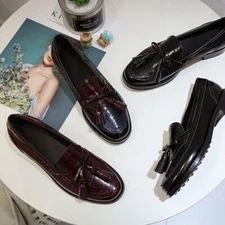 Tod's women's leather flat bottomed tassel carved loafers shoes