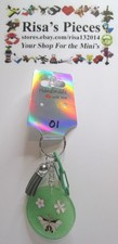 Green Keychain with Butterflies and Flowers