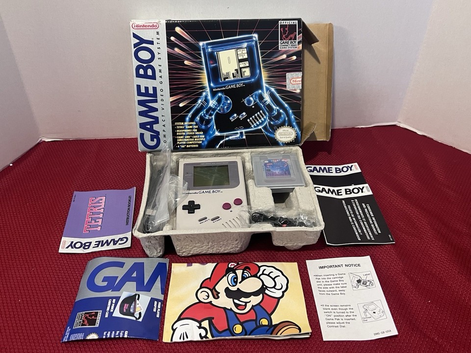 A complete-in-box, tested original 1989 Game Boy with Tetris — the holy grail of starter retro collectibles that any teen would actually brag about owning.