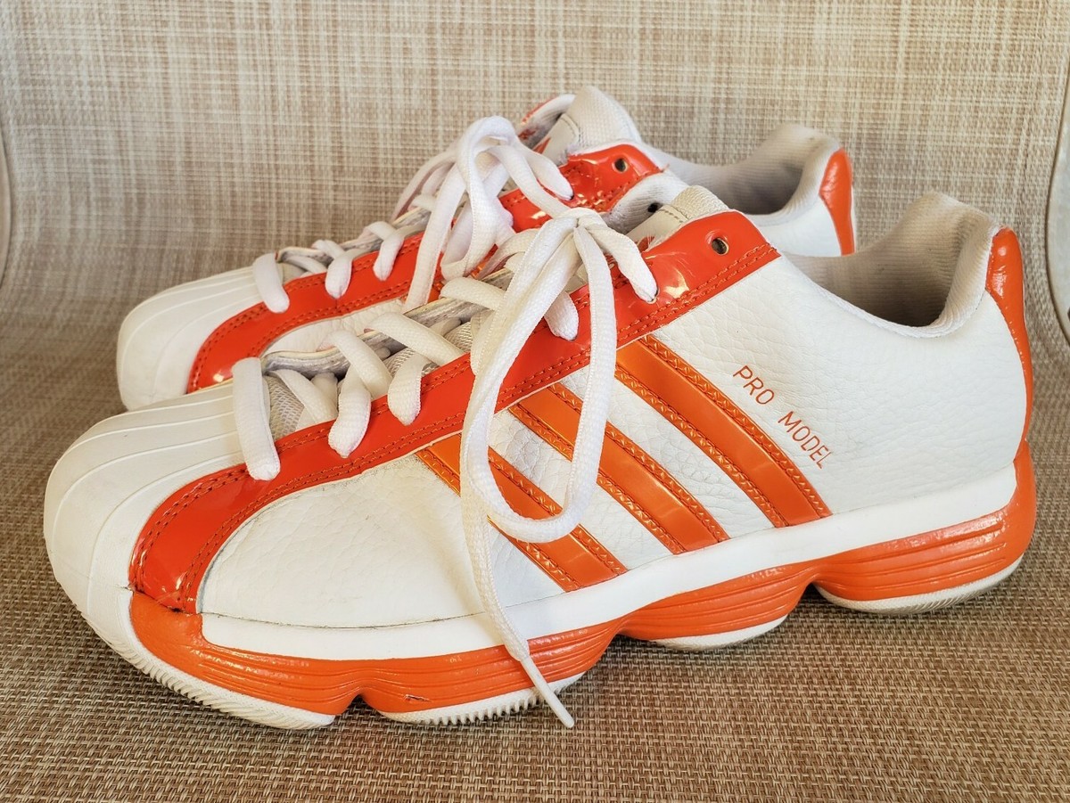adidas shoes with orange stripes