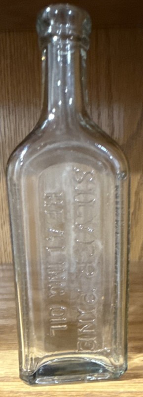 Vintage International Food Co. Embossed Clear Glass Food Bottle
