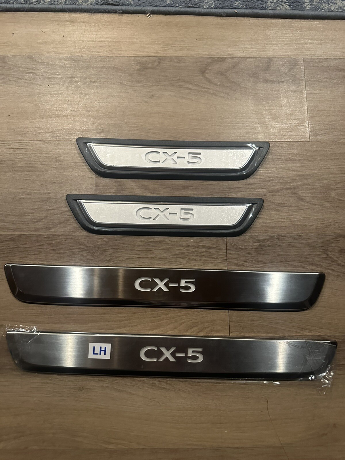 NEW OEM Mazda 20222023 CX5 Illuminated Door Sill Trim Plates KBH1V1