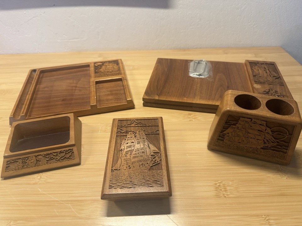 Laser-engraved tall ships on American walnut wood — this mid-century desk set is basically nautical wall art you can write on.