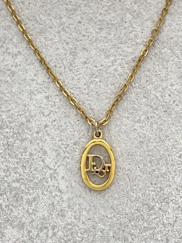 Collana Christian Dior motivo logo con top oro da donna usata