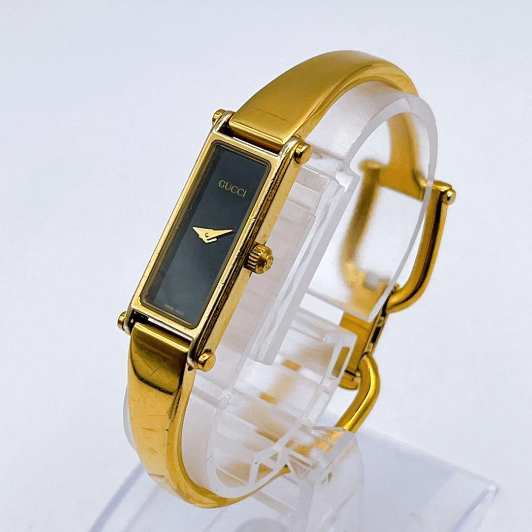 [Presque comme neuve] Montre femme Gucci 1500 bracelet or cadran noir quartz 16 cm vintage