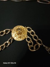 Gold Colored Lions Head belt. Measures 6 feet In length Great ACCESSORY
