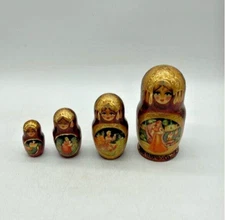 Russian Made Vintage 4 Piece Nesting Dolls Hand Painted  Tallest one is 7in High