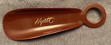 Vintage shoe horn-Hyatt Hotel. brownr color plastic, 5.5" x 1.5"