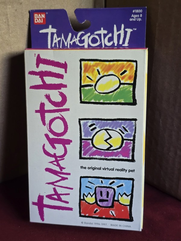 BANDAI TAMAGOTCHI 1997 version #1800 Purple with Pink, new sealed box